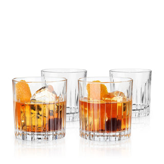 a group of glasses with liquid and ice
