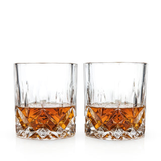 two glasses with amber liquid