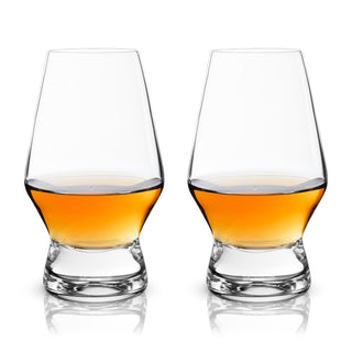 two glasses with amber liquid